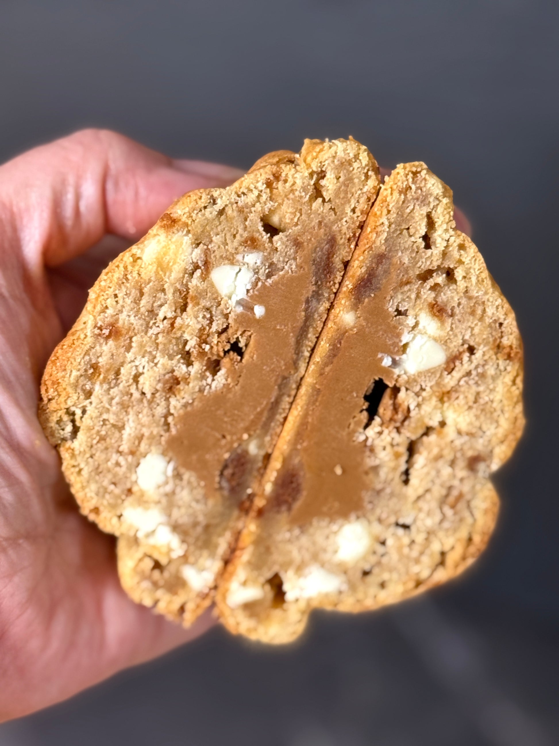 Biscoff Billionaire cookie showing molten Biscoff filling and caramelised biscuit pieces 