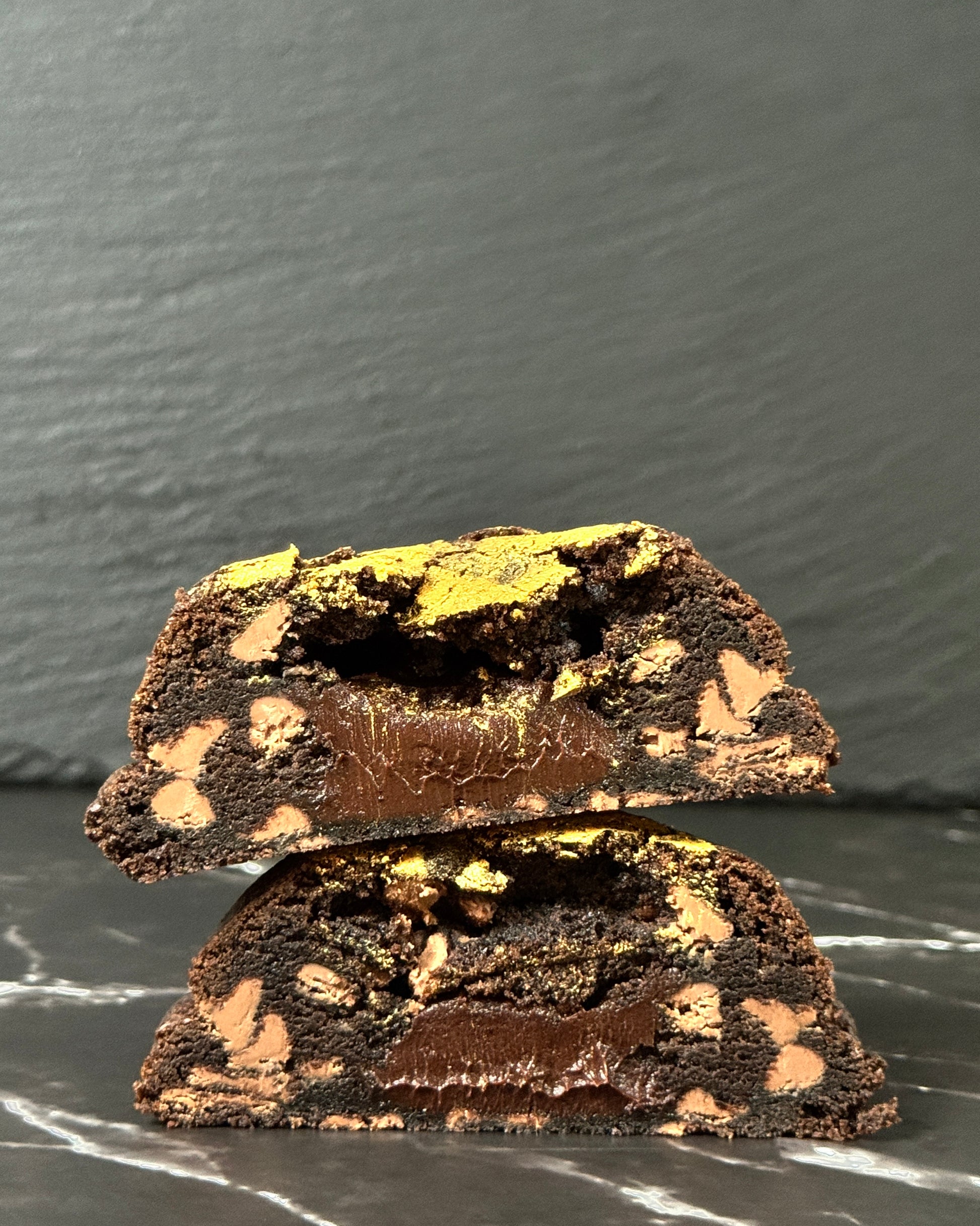 Double Trouble chocolate cookie showing gooey chocolate ganache centre and Callebaut chocolate chunks