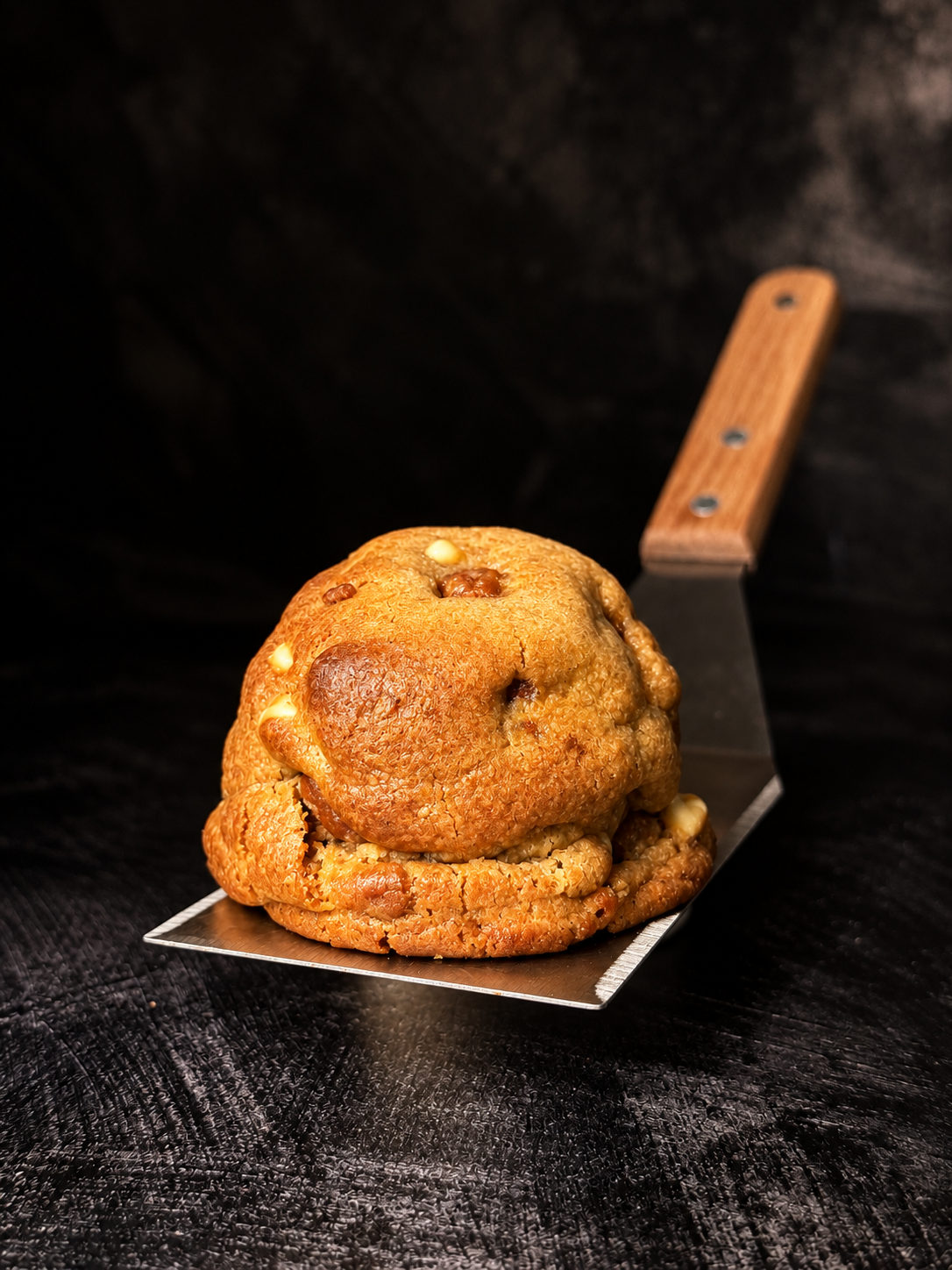 Thick Biscoff Billionaire cookie with white chocolate pieces and Biscoff biscuit, handmade in Dartmoor by Black Bird Bakers