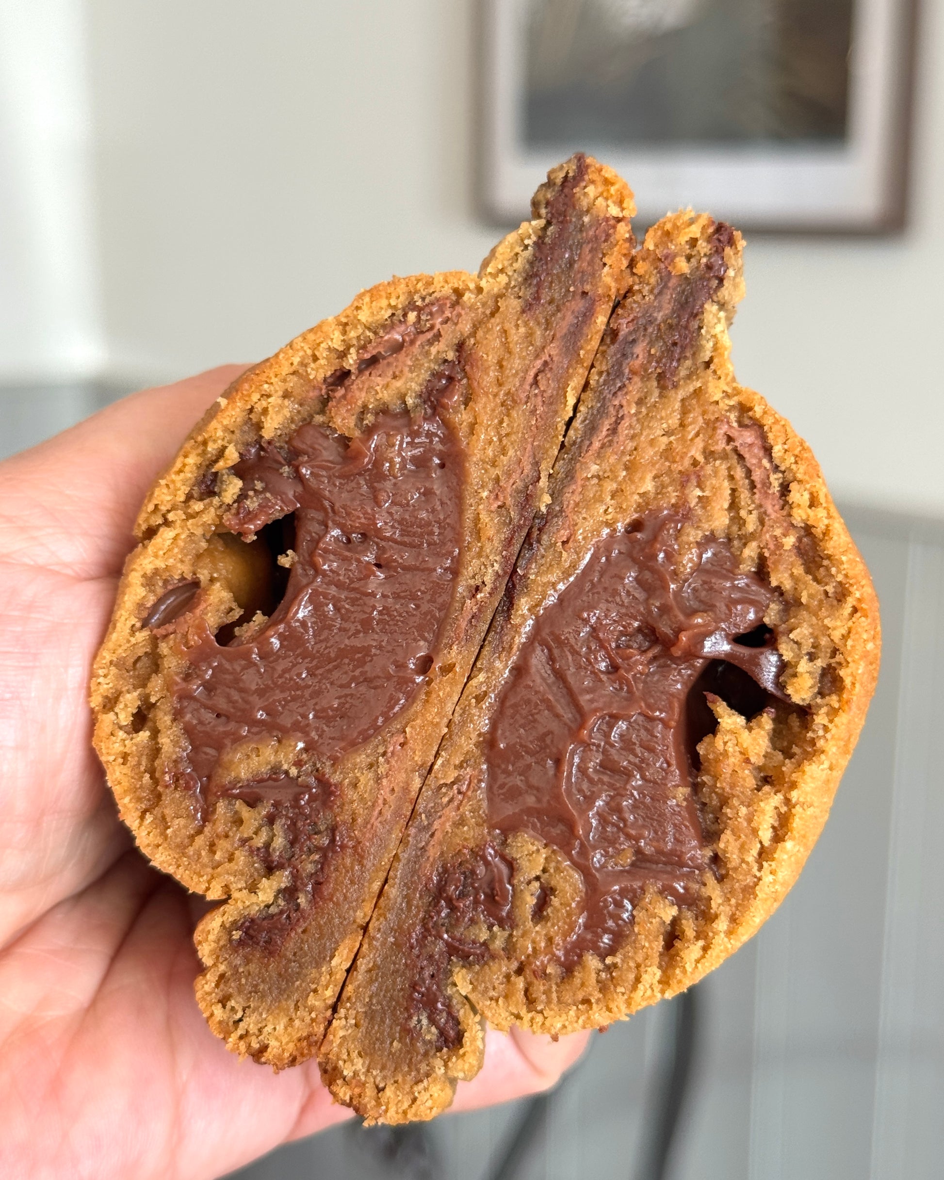 The Belgian cookie showing gooey Belgian chocolate ganache centre and Belgian chocolate chips