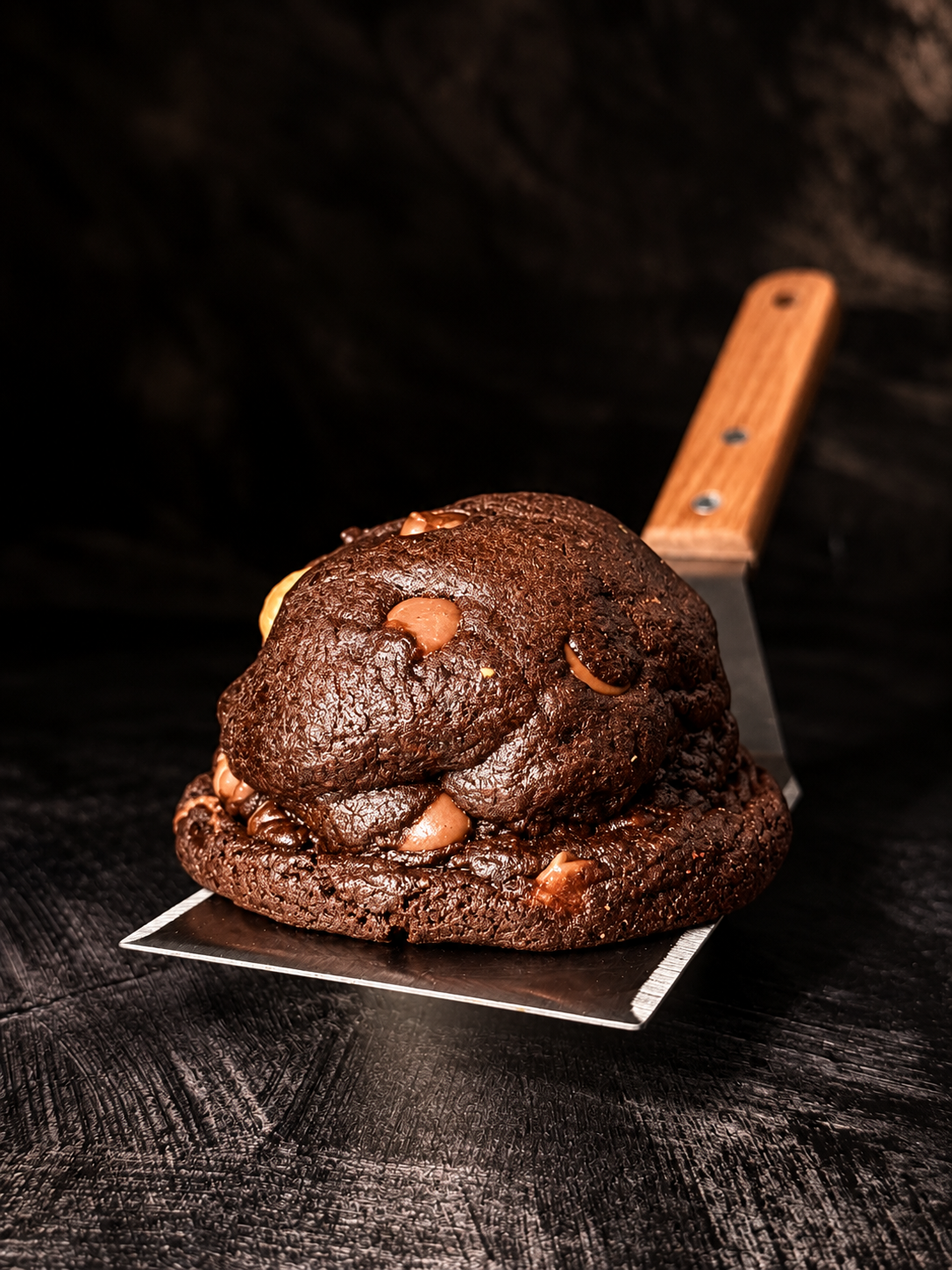 Thick handmade Midnight Noir chocolate cookie with Belgian chocolate chunks, baked in Dartmoor by Black Bird Bakers.