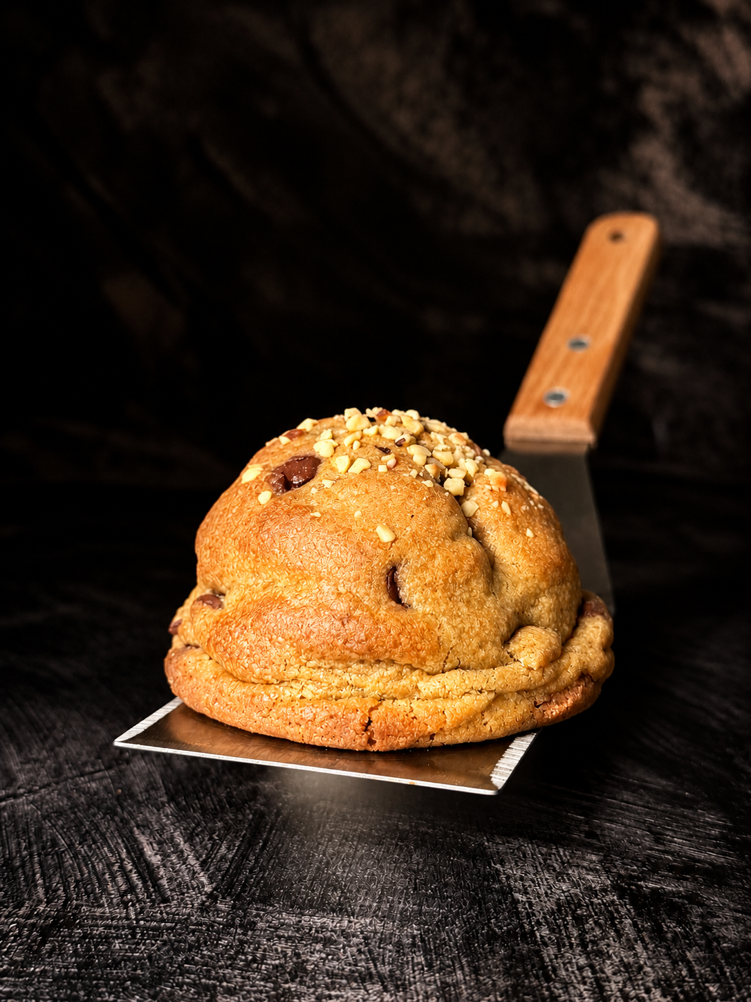 Thick handmade Rocher Royale cookie with Belgian chocolate and roasted hazelnuts, baked in Dartmoor by Black Bird Bakers